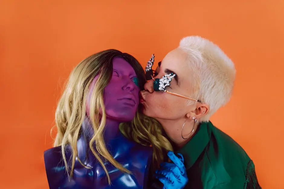 A unique portrait featuring a person interacting with a colorful mannequin on a vibrant orange backdrop.