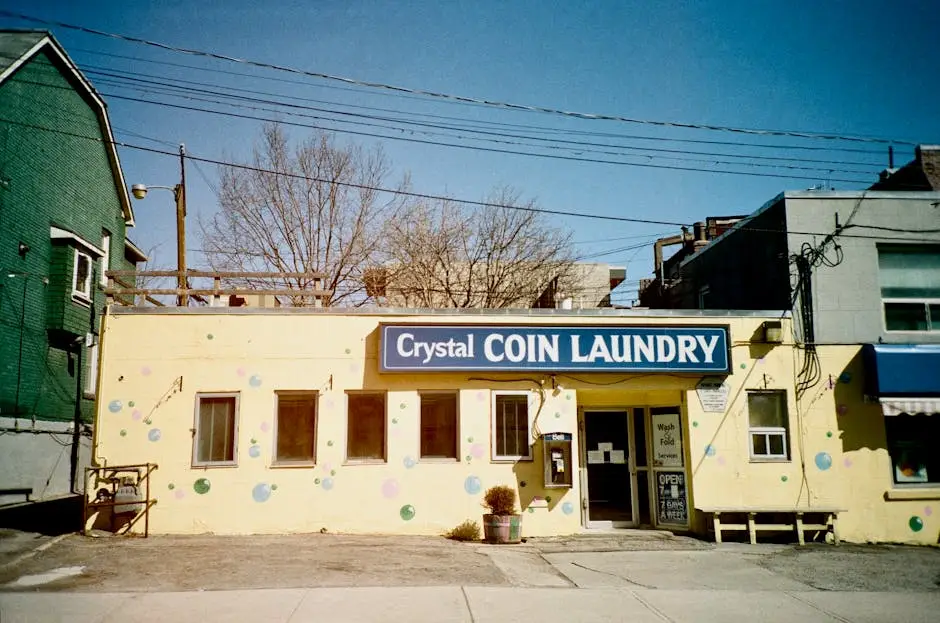 Colorful facade of Crystal Coin Laundry in Toronto on a sunny day.