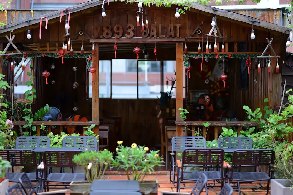 Charming rustic wooden cafe with festive decorations and greenery in Dalat. Perfect for cozy outdoor dining.